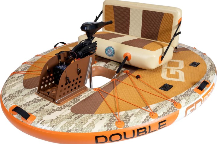 Circular inflatable boat with camo pattern, motor, and padded seat.